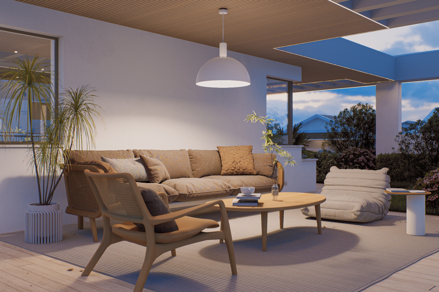 Salotto outdoor sotto la pergola con divano e sedute morbide