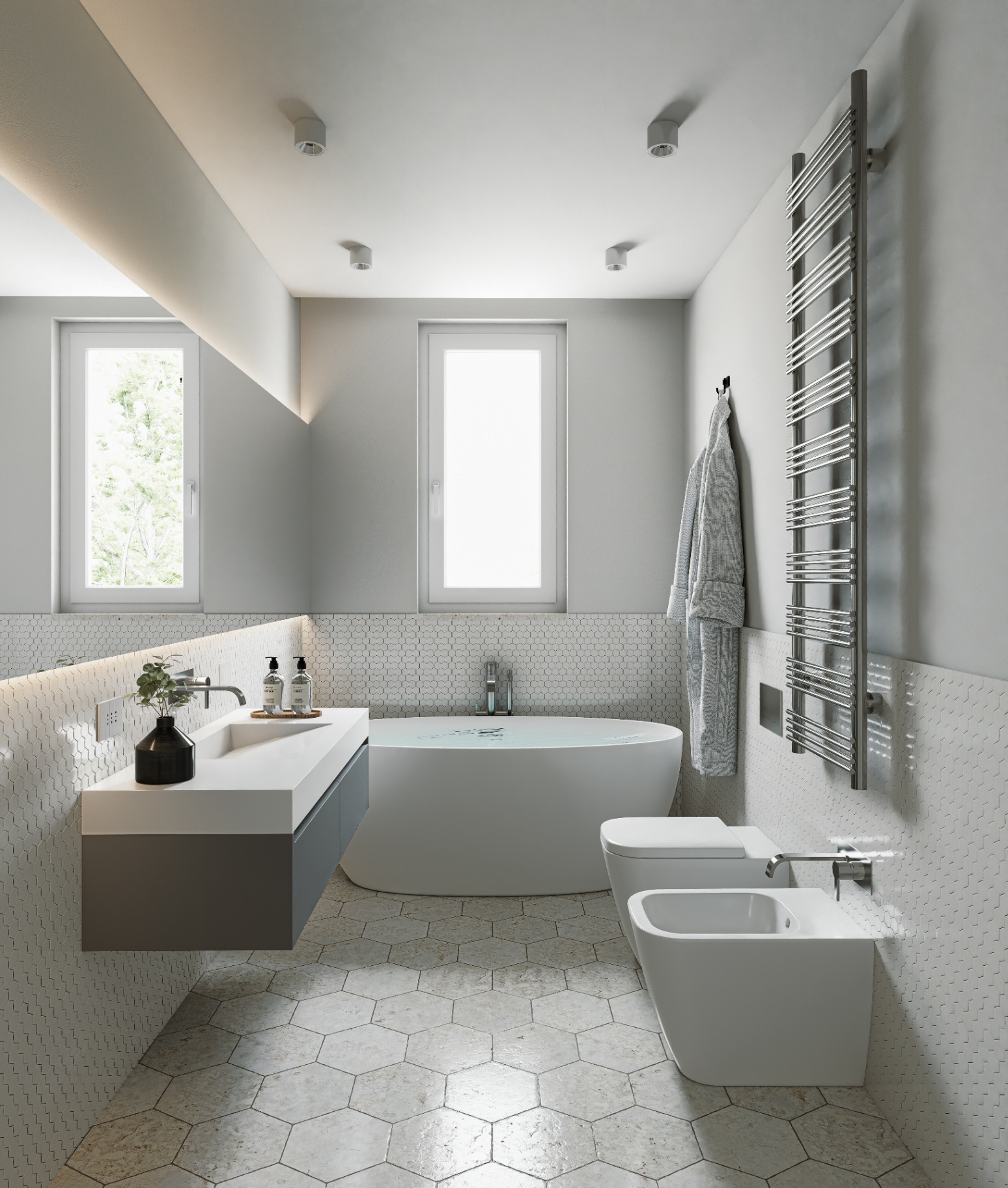Bagno padronale con vasca freestanding e mosaico esagonale